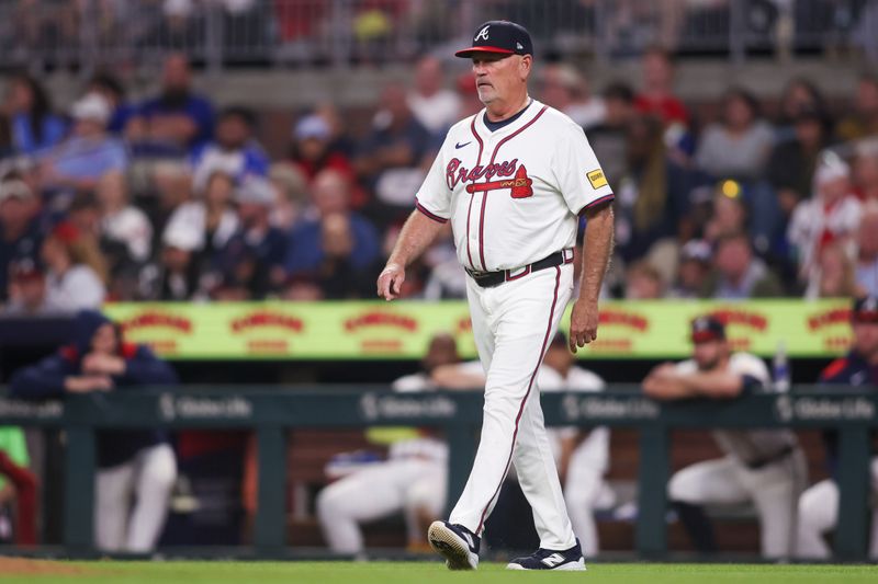 Jun 4, 2025; Atlanta, Georgia, USA; Atlanta Braves manager Brian Snitker (43) walks on the field against the Arizona Diamondbacks in the eighth inning at Truist Park. Mandatory Credit: Brett Davis-Imagn Images
