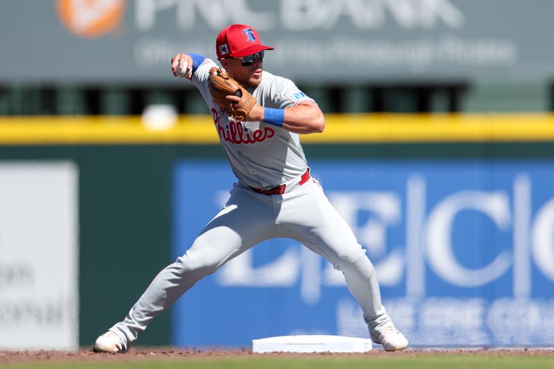 Mar 7, 2025; Bradenton, Florida, USA; Philadelphia Phillies second baseman Rafael Lantigua (83) throws to first base against the Pittsburgh Pirates in the fourth inning during spring training at LECOM Park. Mandatory Credit: Nathan Ray Seebeck-Imagn Images