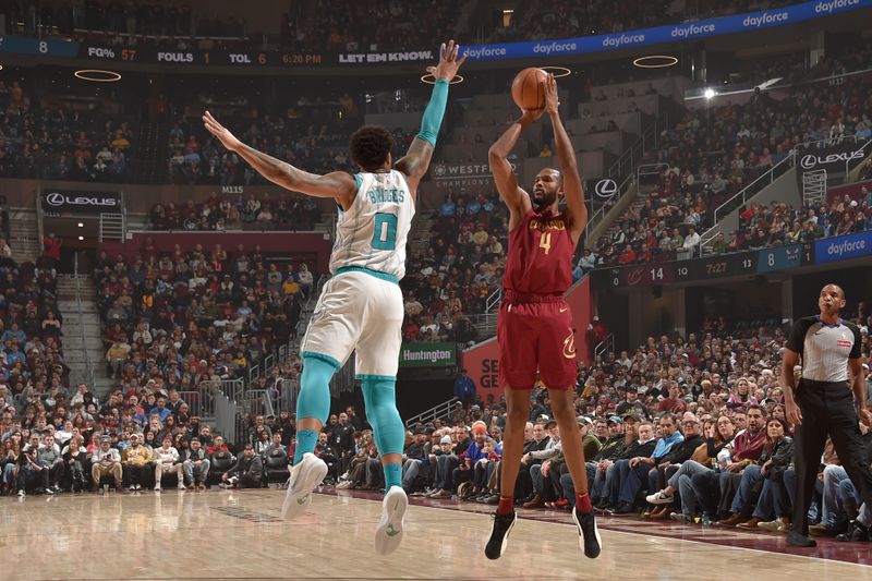 CLEVELAND, OH - JANUARY 5: Evan Mobley #4 of the Cleveland Cavaliers shoots a three point basket during the game against the Charlotte Hornets on January 5, 2025 at Rocket Mortgage FieldHouse in Cleveland, Ohio. NOTE TO USER: User expressly acknowledges and agrees that, by downloading and/or using this Photograph, user is consenting to the terms and conditions of the Getty Images License Agreement. Mandatory Copyright Notice: Copyright 2025 NBAE (Photo by David Liam Kyle/NBAE via Getty Images)