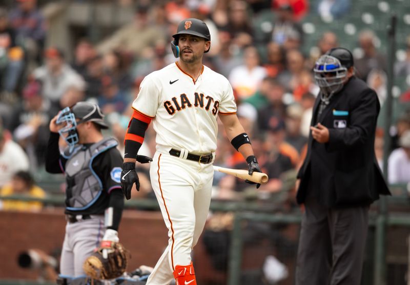 May 20, 2023; San Francisco, California, USA; San Francisco Giants right fielder Michael Conforto (center) reacts to striking out, for the fourth time in the game, against the Miami Marlins during the ninth inning at Oracle Park. Mandatory Credit: D. Ross Cameron-USA TODAY Sports