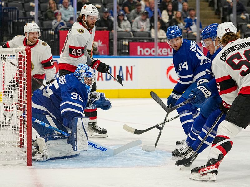 Sep 24, 2022; Toronto, Ontario, CAN; Toronto Maple Leafs goaltender Ilya Samsonov (35) makes a save as Ottawa Senators forward Angus Crookshank (59) and Toronto Maple Leafs forward Bobby McMann (74) and defenseman Mikko Kokkonen (84) close in during the first period at Scotiabank Arena. Mandatory Credit: John E. Sokolowski-USA TODAY Sports