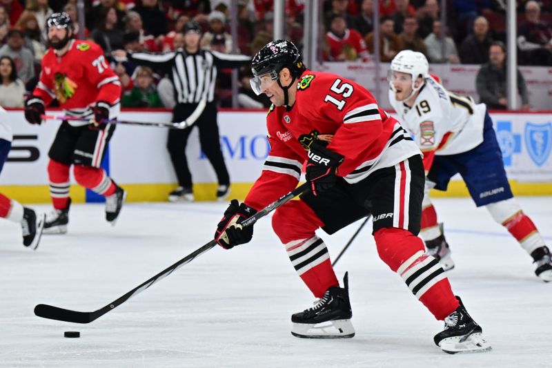 Nov 21, 2024; Chicago, Illinois, USA; Chicago Blackhawks center Craig Smith (15) skates with the puck against the Florida Panthers during the second period at the United Center. Mandatory Credit: Daniel Bartel-Imagn Images