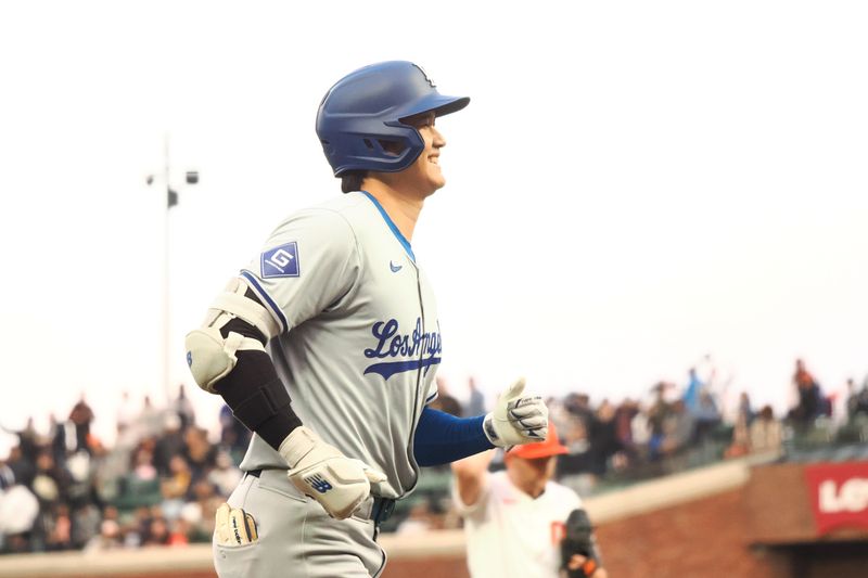 May 14, 2024; San Francisco, California, USA; Los Angeles Dodgers designated hitter Shohei Ohtani (17) smiles as he rounds the bases after hitting a solo home run against San Francisco Giants starting pitcher Keaton Winn (67) during the fourth inning at Oracle Park. Mandatory Credit: Kelley L Cox-USA TODAY Sports