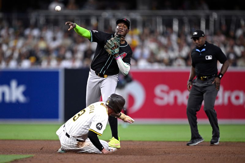 Jul 6, 2024; San Diego, California, USA; Arizona Diamondbacks shortstop Geraldo Perdomo (2) throws to first base after forcing out San Diego Padres center fielder Jackson Merrill (3) at second base to complete a double play during the fourth inning at Petco Park. Mandatory Credit: Orlando Ramirez-USA TODAY Sports