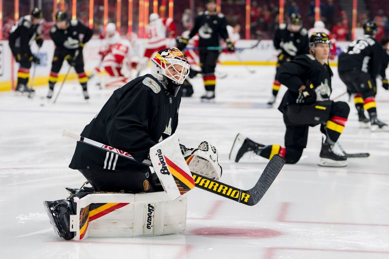 Feb 13, 2023; Vancouver, British Columbia, CAN; Vancouver Canucks goalie Collin Delia (60) stretches during warm up prior to a game against the Detroit Red Wings at Rogers Arena. Mandatory Credit: Bob Frid-USA TODAY Sports