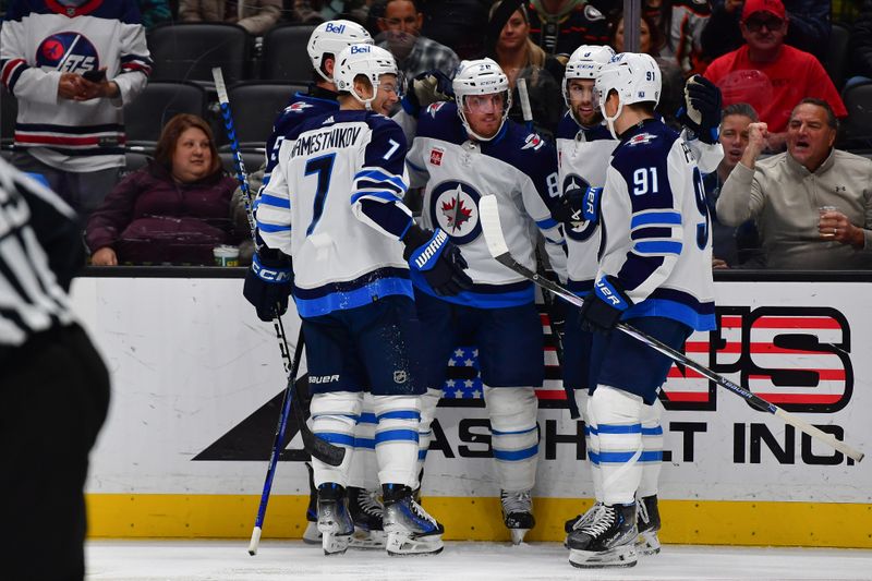 Jan 5, 2024; Anaheim, California, USA; Winnipeg Jets celebrate the goal scored by defenseman Nate Schmidt (88) against the Anaheim Ducks during the third period at Honda Center. Mandatory Credit: Gary A. Vasquez-USA TODAY Sports