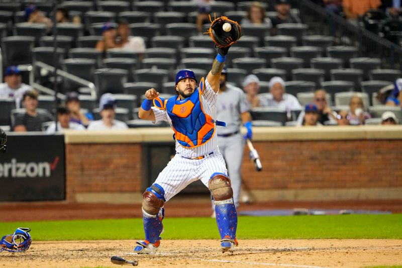 Aug 30, 2023; New York City, New York, USA;  New York Mets catcher Omar Narvaez (2) catches a throw to get the force out at home plate during the tenth inning against the Texas Rangers at Citi Field. Mandatory Credit: Gregory Fisher-USA TODAY Sports