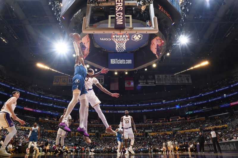 LOS ANGELES, CA - MARCH 10: Anthony Davis #3 of the Los Angeles Lakers blocks the shot during the game against the Minnesota Timberwolves on March 10, 2024 at Crypto.Com Arena in Los Angeles, California. NOTE TO USER: User expressly acknowledges and agrees that, by downloading and/or using this Photograph, user is consenting to the terms and conditions of the Getty Images License Agreement. Mandatory Copyright Notice: Copyright 2024 NBAE (Photo by Adam Pantozzi/NBAE via Getty Images)