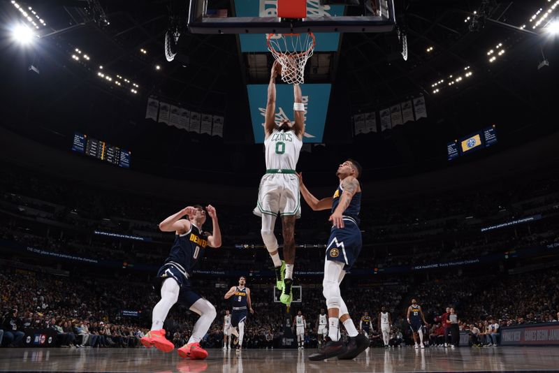 DENVER, CO - JANUARY 7: Jayson Tatum #0 of the Boston Celtics drives to the basket during the game against the Denver Nuggets on January 7, 2025 at Ball Arena in Denver, Colorado. NOTE TO USER: User expressly acknowledges and agrees that, by downloading and/or using this Photograph, user is consenting to the terms and conditions of the Getty Images License Agreement. Mandatory Copyright Notice: Copyright 2025 NBAE (Photo by Garrett Ellwood/NBAE via Getty Images)