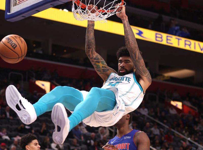 DETROIT, MICHIGAN - JANUARY 24: Nick Richards #4 of the Charlotte Hornets dunks in front of Jalen Duren #0 of the Detroit Pistons during the second half at Little Caesars Arena on January 24, 2024 in Detroit, Michigan. NOTE TO USER: User expressly acknowledges and agrees that, by downloading and or using this photograph, User is consenting to the terms and conditions of the Getty Images License  (Photo by Gregory Shamus/Getty Images)