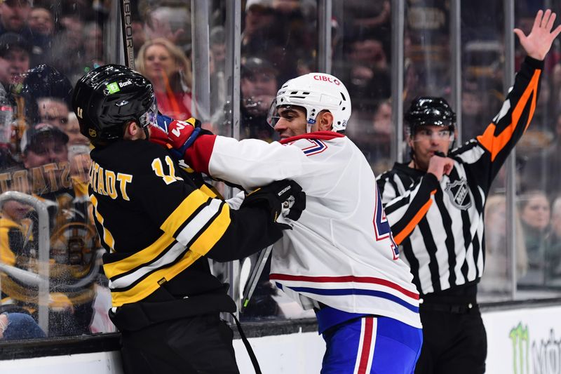 Dec 23, 2025; Boston, Massachusetts, USA; Montreal Canadians defenseman Jayden Struble (47) pushes Boston Bruins center Casey Mittelstadt (11) during the first period at TD Garden. Mandatory Credit: Bob DeChiara-Imagn Images