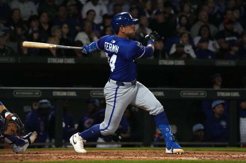 Mar 6, 2025; Mesa, Arizona, USA; Kansas City Royals catcher Freddy Fermin (34) hits an RBI double against the Chicago Cubs in the third inning at Sloan Park. Mandatory Credit: Rick Scuteri-Imagn Images