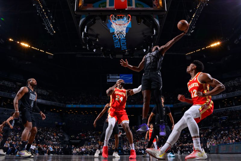 BROOKLYN, NY - FEBRUARY 29: Day'Ron Sharpe #20 of the Brooklyn Nets rebounds the ball during the game against the Atlanta Hawks on February 29, 2024 at Barclays Center in Brooklyn, New York. NOTE TO USER: User expressly acknowledges and agrees that, by downloading and or using this Photograph, user is consenting to the terms and conditions of the Getty Images License Agreement. Mandatory Copyright Notice: Copyright 2024 NBAE (Photo by Jesse D. Garrabrant/NBAE via Getty Images)