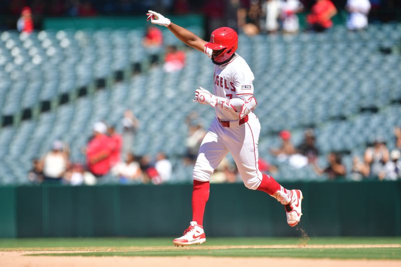 Jun 27, 2024; Anaheim, California, USA; Los Angeles Angels right fielder Jo Adell (7) runs the bases after hitting a two run home run against the Detroit Tigers during the ninth inning at Angel Stadium. Mandatory Credit: Gary A. Vasquez-USA TODAY Sports