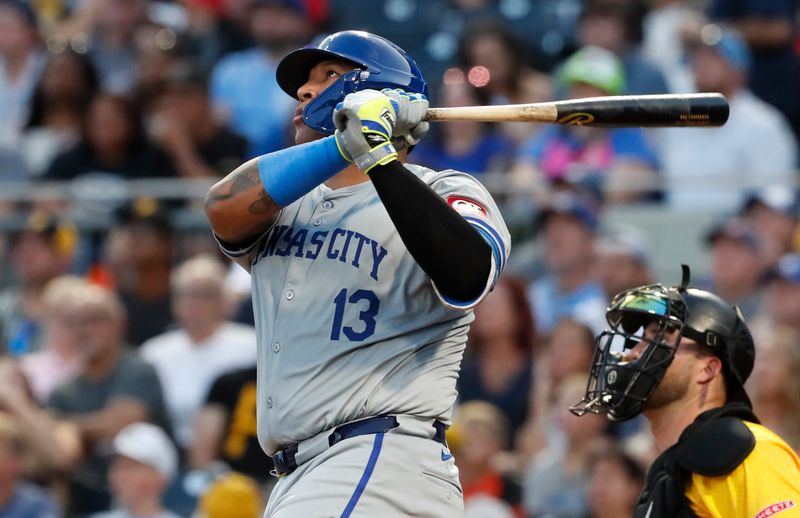 Sep 13, 2024; Pittsburgh, Pennsylvania, USA;  Kansas City Royals catcher Salvador Perez (13) hits a two run home run against the Pittsburgh Pirates during the second inning at PNC Park. Mandatory Credit: Charles LeClaire-Imagn Images