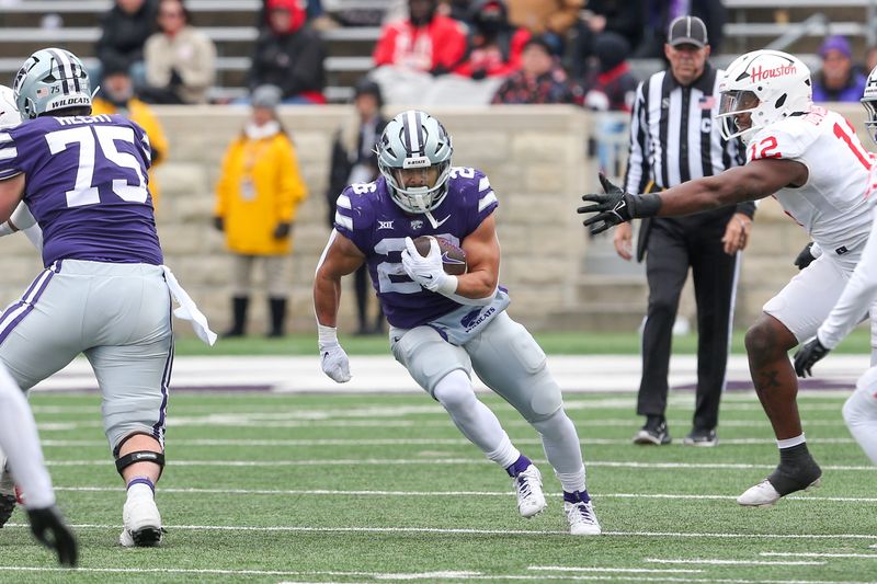 Oct 28, 2023; Manhattan, Kansas, USA; Kansas State Wildcats running back Anthony Frias II (26) runs the ball during the fourth quarter against the Houston Cougars at Bill Snyder Family Football Stadium. Mandatory Credit: Scott Sewell-USA TODAY Sports