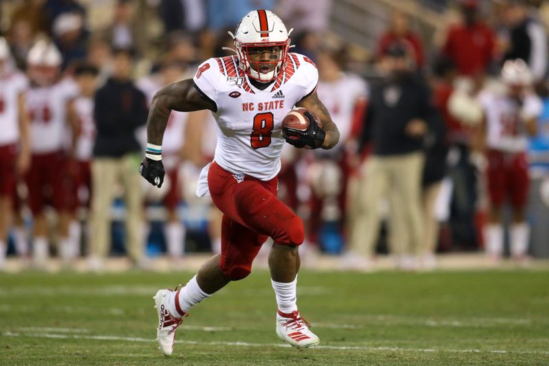 Nov 21, 2019; Atlanta, GA, USA; North Carolina State Wolfpack running back Ricky Person Jr. (8) runs the ball against the Georgia Tech Yellow Jackets in the first half at Bobby Dodd Stadium. Mandatory Credit: Brett Davis-USA TODAY Sports