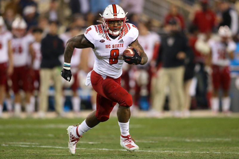 Nov 21, 2019; Atlanta, GA, USA; North Carolina State Wolfpack running back Ricky Person Jr. (8) runs the ball against the Georgia Tech Yellow Jackets in the first half at Bobby Dodd Stadium. Mandatory Credit: Brett Davis-USA TODAY Sports