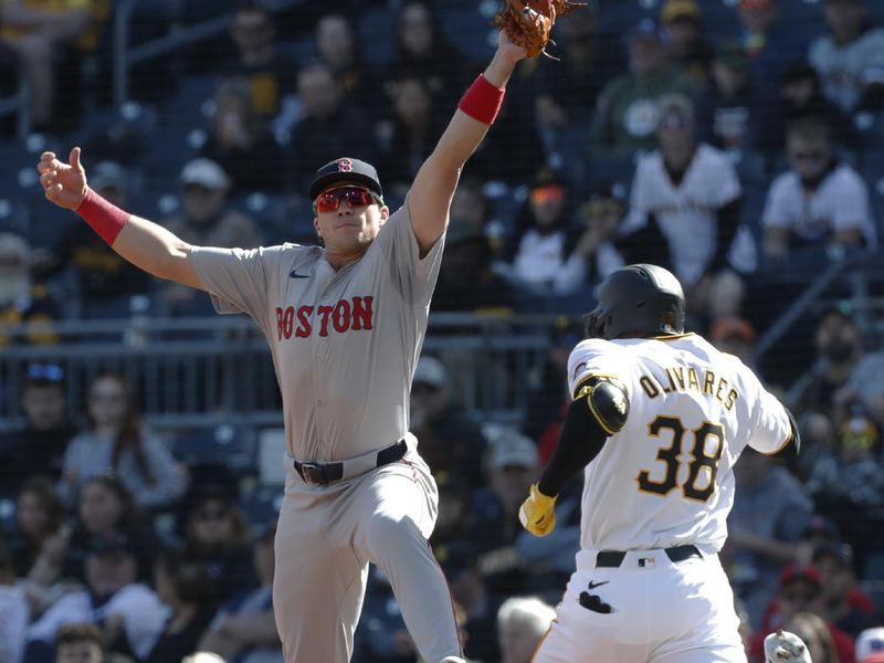 Apr 20, 2024; Pittsburgh, Pennsylvania, USA;  Boston Red Sox first baseman Triston Casas (36) takes a high throw to retire Pittsburgh Pirates designated hitter Edward Olivares (38) during the first inning at PNC Park. Mandatory Credit: Charles LeClaire-USA TODAY Sports