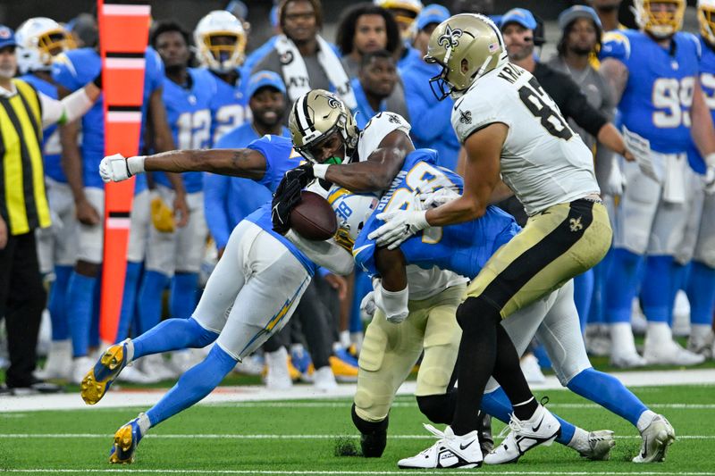 New Orleans Saints wide receiver Shaquan Davis (88) pulls in a pass over Los Angeles Chargers cornerback Cam Brown (38) in the second half of an NFL football game in Inglewood, Calif., Sunday, Aug. 20, 2023. (AP Photo/Alex Gallardo)