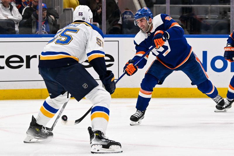 Mar 5, 2024; Elmont, New York, USA;  New York Islanders center Kyle Palmieri (21) shoots against St. Louis Blues defenseman Colton Parayko (55) during the second period at UBS Arena. Mandatory Credit: Dennis Schneidler-USA TODAY Sports