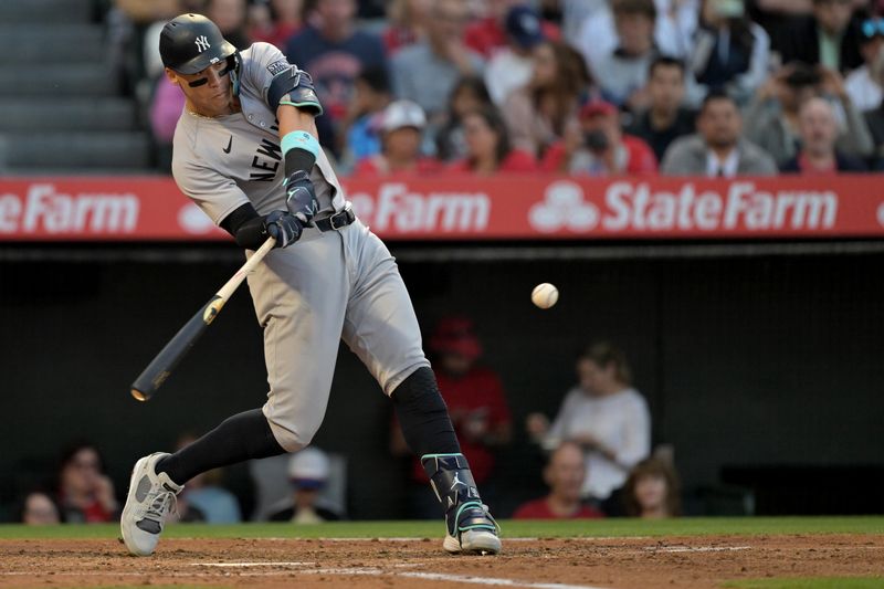 May 30, 2024; Anaheim, California, USA;  New York Yankees center fielder Aaron Judge (99) hits a two-run home run scoring right fielder Juan Soto (22) in the fourth inning against the Los Angeles Angels at Angel Stadium. Mandatory Credit: Jayne Kamin-Oncea-USA TODAY Sports