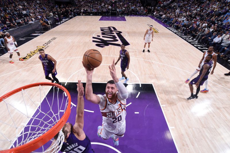 SACRAMENTO, CA - APRIL 12: Jusuf Nurkic #20 of the Phoenix Suns drives to the basket during the game against the Sacramento Kings on April 12, 2024 at Golden 1 Center in Sacramento, California. NOTE TO USER: User expressly acknowledges and agrees that, by downloading and or using this Photograph, user is consenting to the terms and conditions of the Getty Images License Agreement. Mandatory Copyright Notice: Copyright 2024 NBAE (Photo by Rocky Widner/NBAE via Getty Images)