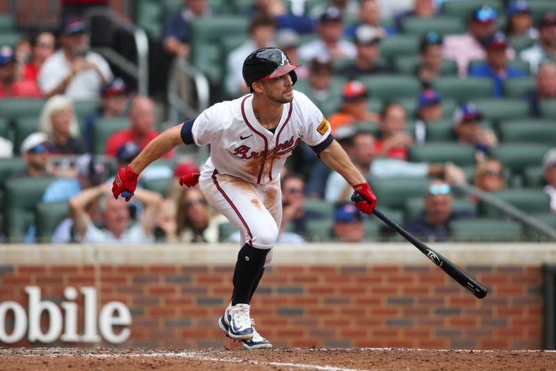 Sep 30, 2024; Atlanta, Georgia, USA; Atlanta Braves left fielder Eli White (36) hits a single against the New York Mets in the ninth inning at Truist Park. Mandatory Credit: Brett Davis-Imagn Images