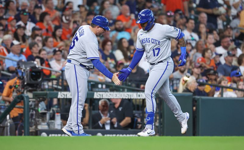 Sep 24, 2023; Houston, Texas, USA; Kansas City Royals right fielder Nelson Velazquez (17) celebrates with major league field coordinator, third base coach Vance Wilson (25) after hitting a home run during the second inning against the Houston Astros at Minute Maid Park. Mandatory Credit: Troy Taormina-USA TODAY Sports