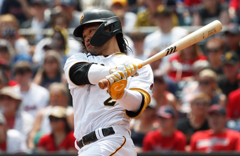 Jul 19, 2023; Pittsburgh, Pennsylvania, USA;  Pittsburgh Pirates pinch hitter Connor Joe (2) hits a single against the Cleveland Guardians during the seventh inning at PNC Park. Mandatory Credit: Charles LeClaire-USA TODAY Sports