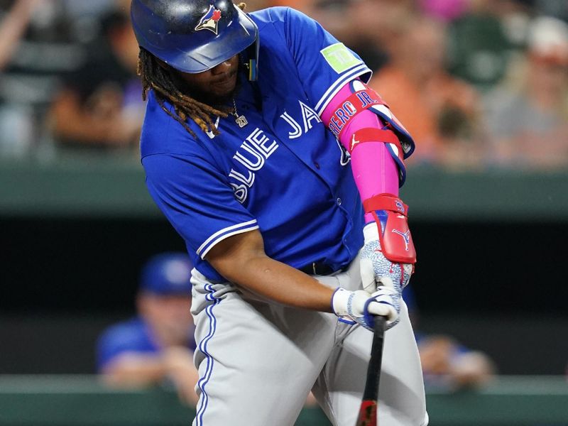 Aug 24, 2023; Baltimore, Maryland, USA; Toronto Blue Jays designated hitter Vladimir Guerrero Jr. (27) drives in a run with a fielders choice in the fourth inning against the Baltimore Orioles at Oriole Park at Camden Yards. Mandatory Credit: Mitch Stringer-USA TODAY Sports