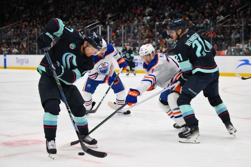 Mar 2, 2024; Seattle, Washington, USA; Edmonton Oilers center Ryan McLeod (71) reaches in for the puck possessed by Seattle Kraken center Jaden Schwartz (17) during the second period at Climate Pledge Arena. Mandatory Credit: Steven Bisig-USA TODAY Sports