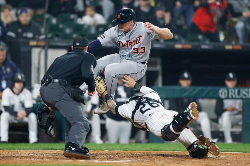 Jun 4, 2025; Chicago, Illinois, USA; Chicago White Sox catcher Korey Lee (26) tags out at home plate Detroit Tigers designated hitter Colt Keith (33) during the eight inning at Rate Field. Mandatory Credit: Kamil Krzaczynski-Imagn Images