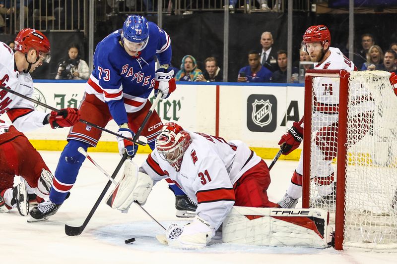 May 5, 2024; New York, New York, USA; Carolina Hurricanes goaltender Frederik Andersen (31) makes a save on a shot on goal attempt by New York Rangers center Matt Rempe (73) in the second period in game one of the second round of the 2024 Stanley Cup Playoffs at Madison Square Garden. Mandatory Credit: Wendell Cruz-USA TODAY Sports