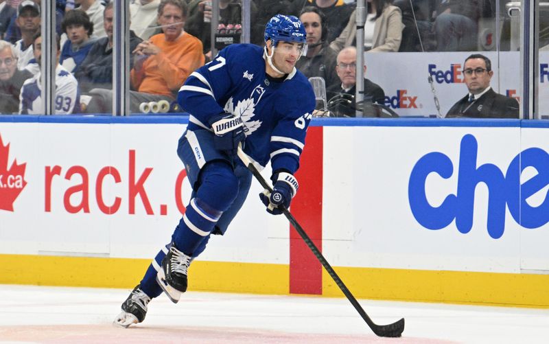 Oct 31, 2024; Toronto, Ontario, CAN;  Toronto Maple Leafs forward Max Pacioretty (67) skates with the puck against the Seattle Kraken in the first period at Scotiabank Arena. Mandatory Credit: Dan Hamilton-Imagn Images