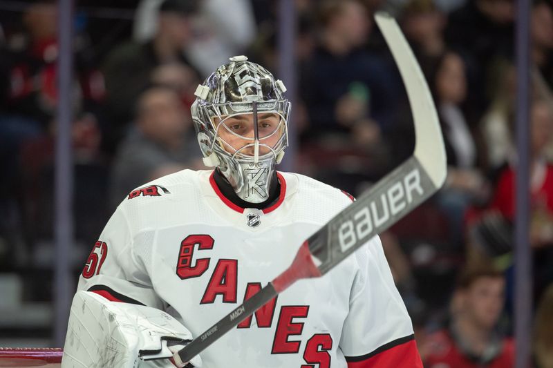 Dec 12, 2023; Ottawa, Ontario, CAN; Carolina Hurricanes goalie Pyotr Kochetkov (52) looks on during a break in action in the first period against the Ottawa Senators at the Canadian Tire Centre. Mandatory Credit: Marc DesRosiers-USA TODAY Sports