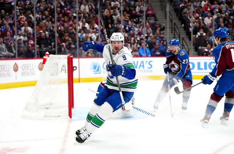 Feb 20, 2024; Denver, Colorado, USA; Vancouver Canucks center J.T. Miller (9) celebrates his goal in the first period against the Colorado Avalanche at Ball Arena. Mandatory Credit: Ron Chenoy-USA TODAY Sports