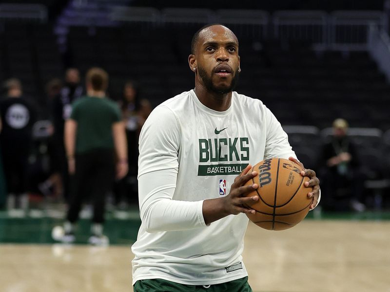 MILWAUKEE, WISCONSIN - DECEMBER 13: Khris Middleton #22 of the Milwaukee Bucks participates in warmups prior to a game against the Golden State Warriors at Fiserv Forum on December 13, 2022 in Milwaukee, Wisconsin. NOTE TO USER: User expressly acknowledges and agrees that, by downloading and or using this photograph, User is consenting to the terms and conditions of the Getty Images License Agreement. (Photo by Stacy Revere/Getty Images)