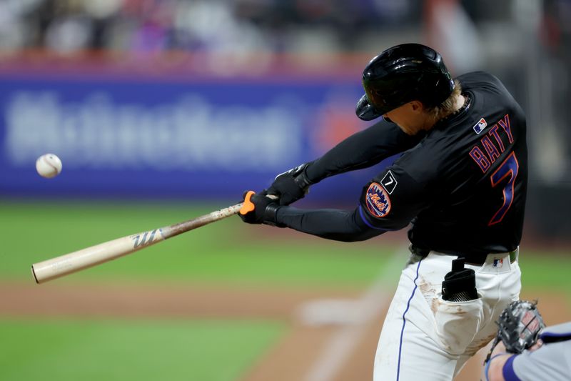 May 23, 2025; New York City, New York, USA; New York Mets second baseman Brett Baty (7) hits a solo home run against the Los Angeles Dodgers during the third inning at Citi Field. Mandatory Credit: Brad Penner-Imagn Images