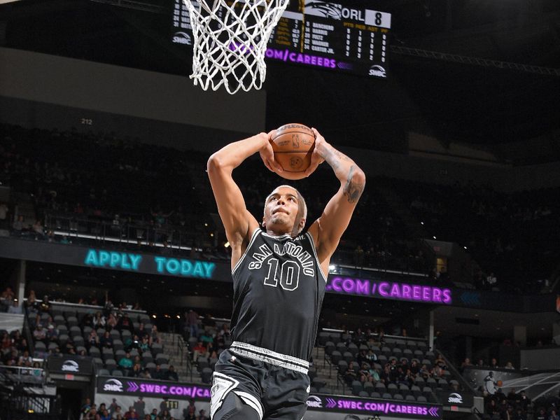 SAN ANTONIO, TX - MARCH 14: Jeremy Sochan #10 of the San Antonio Spurs dunks the ball during the game against the Orlando Magic on March 14, 2023 at the AT&T Center in San Antonio, Texas. NOTE TO USER: User expressly acknowledges and agrees that, by downloading and or using this photograph, user is consenting to the terms and conditions of the Getty Images License Agreement. Mandatory Copyright Notice: Copyright 2023 NBAE (Photos by Michael Gonzales/NBAE via Getty Images)