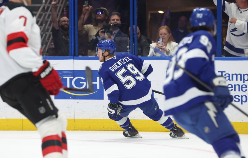 Nov 18, 2025; Tampa, Florida, USA;Tampa Bay Lightning center Jake Guentzel (59) celebrates after he scored a goal against the New Jersey Devils during the first period at Benchmark International Arena. Mandatory Credit: Kim Klement Neitzel-Imagn Images