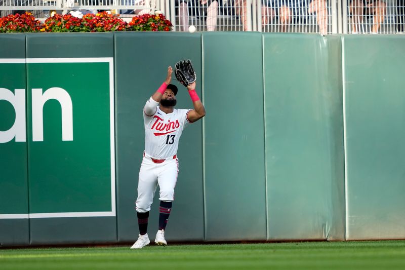 May 8, 2024; Minneapolis, Minnesota, USA; Minnesota Twins left fielder Manuel Margot (13) catches a fly ball against the Seattle Mariners in the first inning at Target Field. Mandatory Credit: Jesse Johnson-USA TODAY Sports