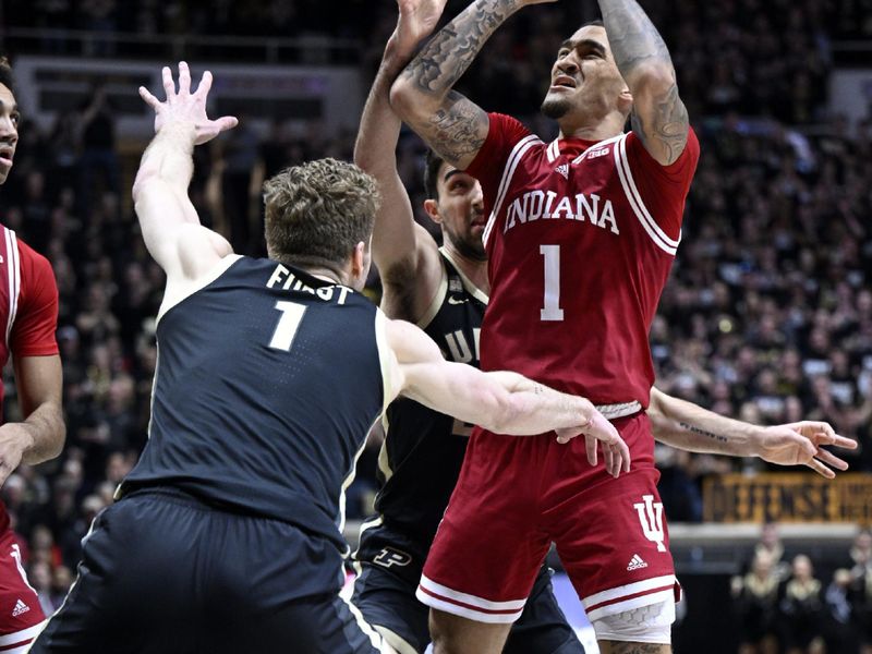 Feb 25, 2023; West Lafayette, Indiana, USA; Indiana Hoosiers guard Jalen Hood-Schifino (1) shoots the ball over Purdue Boilermakers forward Caleb Furst (1) during the first half at Mackey Arena. Mandatory Credit: Marc Lebryk-USA TODAY Sports