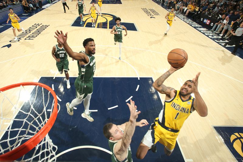 INDIANAPOLIS, IN - APRIL 28: Obi Toppin #1 of the Indiana Pacers drives to the basket during the game against the Milwaukee Bucks during Round 1 Game 4 of the 2024 NBA Playoffs on April 28, 2024 at Gainbridge Fieldhouse in Indianapolis, Indiana. NOTE TO USER: User expressly acknowledges and agrees that, by downloading and or using this Photograph, user is consenting to the terms and conditions of the Getty Images License Agreement. Mandatory Copyright Notice: Copyright 2024 NBAE (Photo by Nathaniel S. Butler/NBAE via Getty Images)