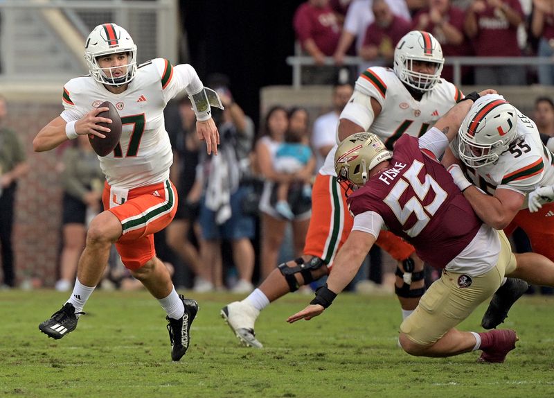 Nov 11, 2023; Tallahassee, Florida, USA; Miami Hurricanes quarterback Emory Williams (17) runs the ball against the Florida State Seminoles during the second half at Doak S. Campbell Stadium. Mandatory Credit: Melina Myers-USA TODAY Sports