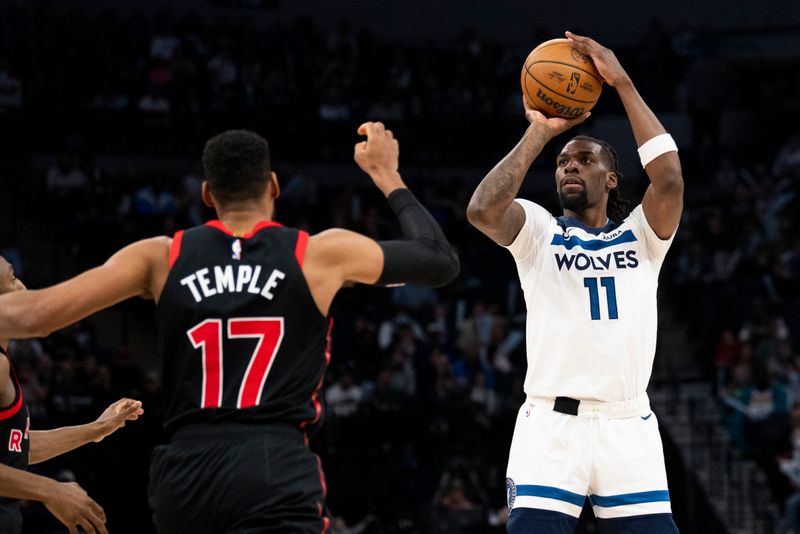 MINNEAPOLIS, MINNESOTA - APRIL 3: Naz Reid #11 of the Minnesota Timberwolves shoots a three point shot in the third quarter of game against the Toronto Raptors at Target Center on April 3, 2024 in Minneapolis, Minnesota. NOTE TO USER: User expressly acknowledges and agrees that, by downloading and or using this photograph, User is consenting to the terms and conditions of the Getty Images License Agreement. (Photo by Stephen Maturen/Getty Images)