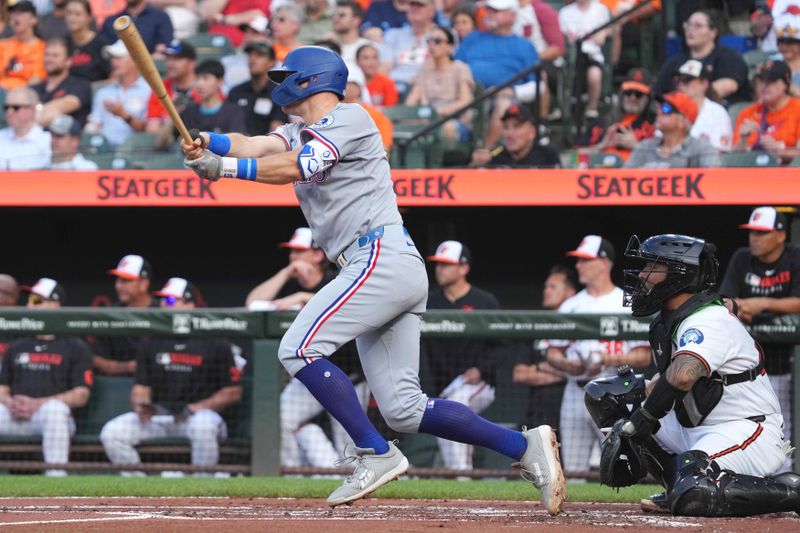 Jun 25, 2025; Baltimore, Maryland, USA; Texas Rangers third baseman Josh Jung (6) drives in a run during the second inning against the Baltimore Orioles at Oriole Park at Camden Yards. Mandatory Credit: Mitch Stringer-Imagn Images