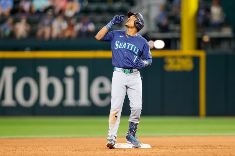 Sep 21, 2024; Arlington, Texas, USA; Seattle Mariners second base Jorge Polanco (7) reacts after hitting a double during the ninth inning against the Texas Rangers at Globe Life Field. Mandatory Credit: Andrew Dieb-Imagn Images