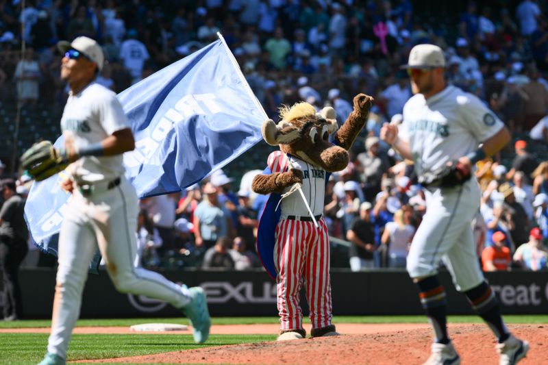 Jul 4, 2024; Seattle, Washington, USA; Seattle Mariners mascot Mariners Moose celebrates the Seattle Mariners victory over the Baltimore Orioles at T-Mobile Park. Mandatory Credit: Steven Bisig-USA TODAY Sports