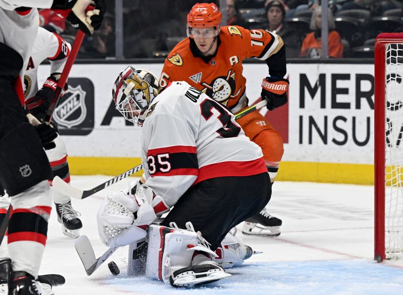 Dec 1, 2024; Anaheim, California, USA;  Ottawa Senators goaltender Linus Ullmark (35) stops a shot with Anaheim Ducks center Ryan Strome (16) watching during the second period at Honda Center. Mandatory Credit: Alex Gallardo-Imagn Images